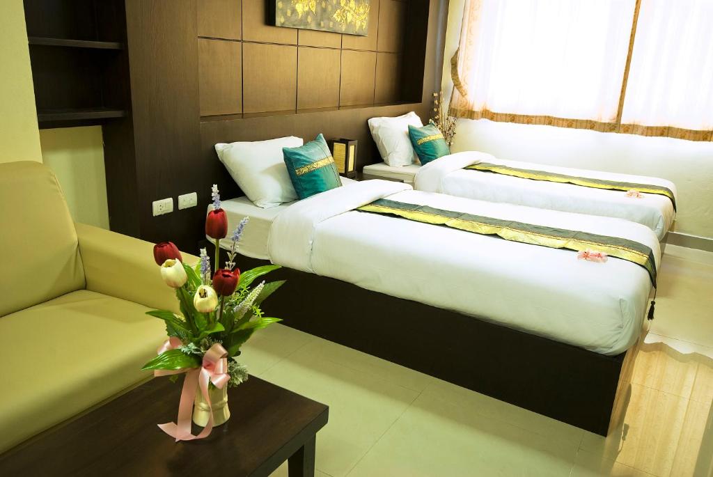 Postel nebo postele na pokoji v ubytování Regent Suvarnabhumi Hotel