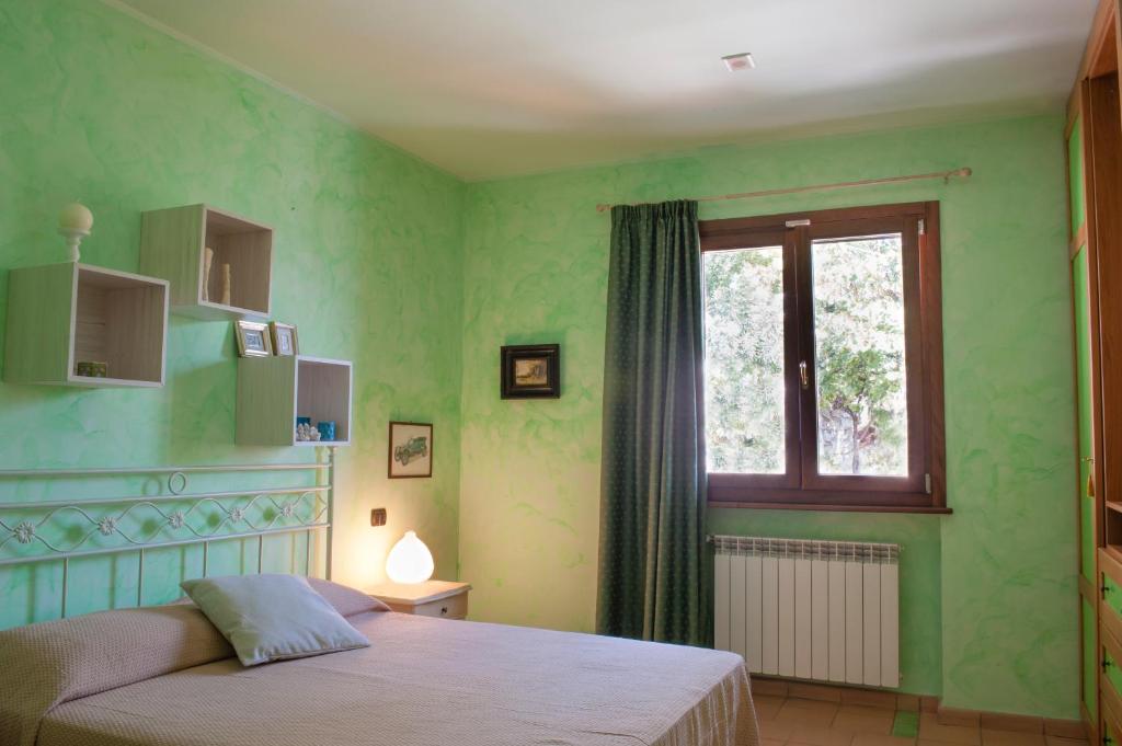 Letto o letti in una camera di La Residenza di Carolina
