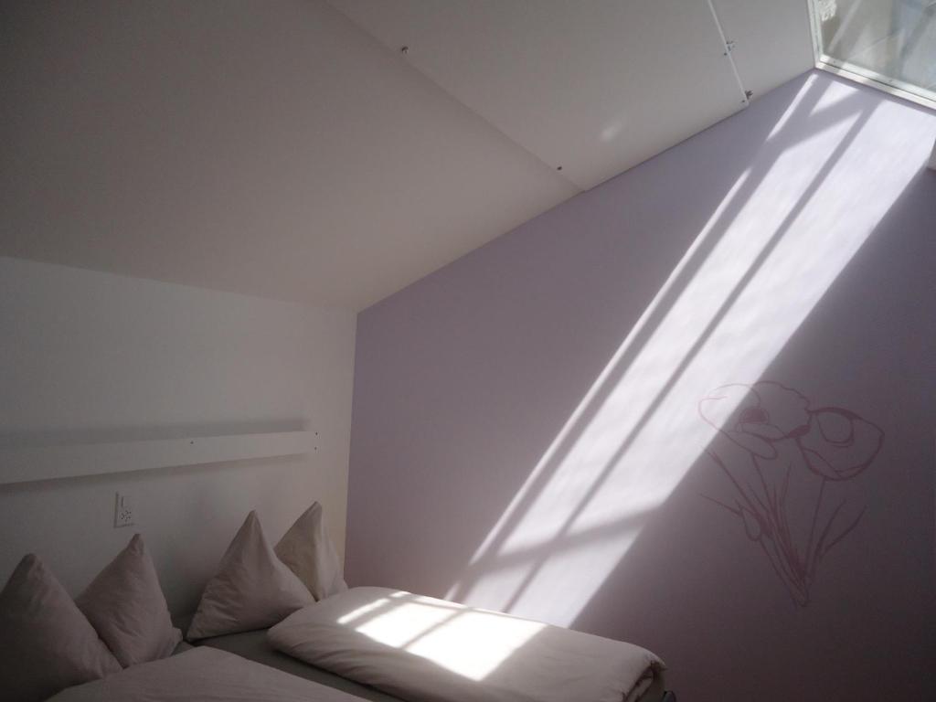 Postel nebo postele na pokoji v ubytování Hotel Alte Gärtnerei