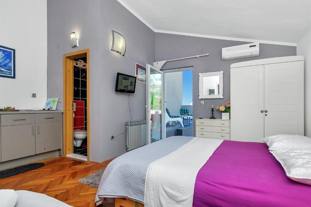 Posteľ alebo postele v izbe v ubytovaní Apartmani Maja