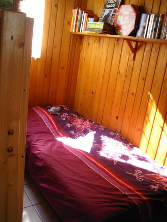 Postel nebo postele na pokoji v ubytování Chalet Camping Les Vignes