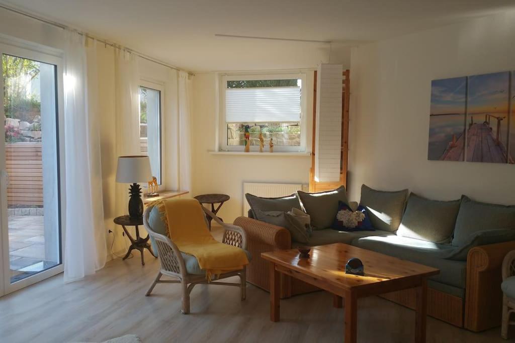 a living room with a couch and a table at Friedland - Groß Schneen GÖ 10 KM in Friedland