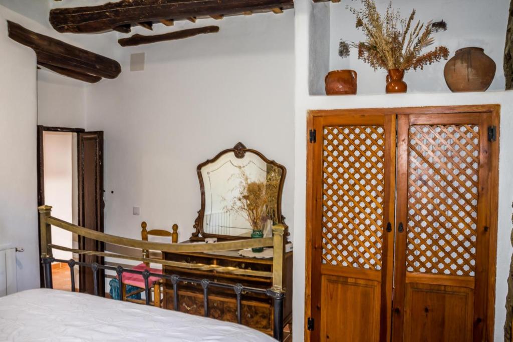 Postel nebo postele na pokoji v ubytování Casa el Portón