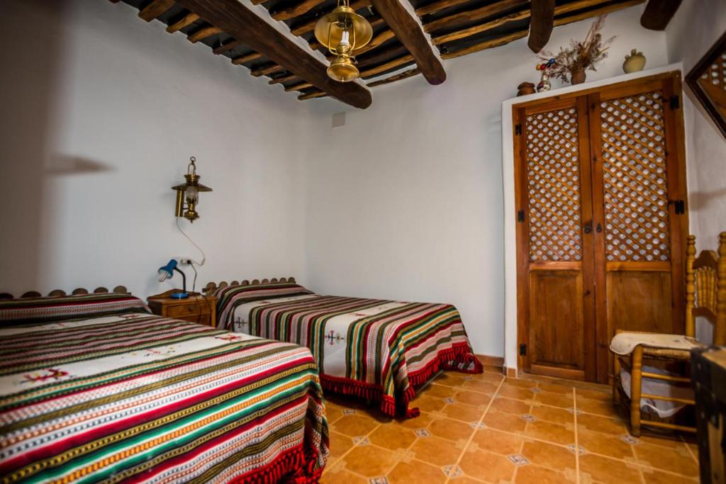 Postel nebo postele na pokoji v ubytování Casa el Portón