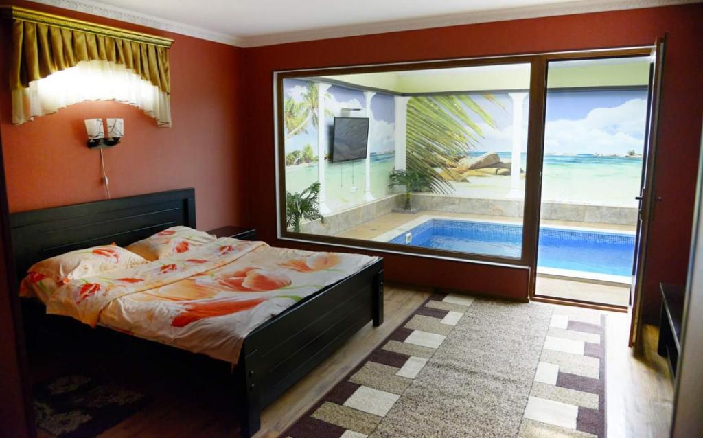 Postel nebo postele na pokoji v ubytování Hotel Emocia