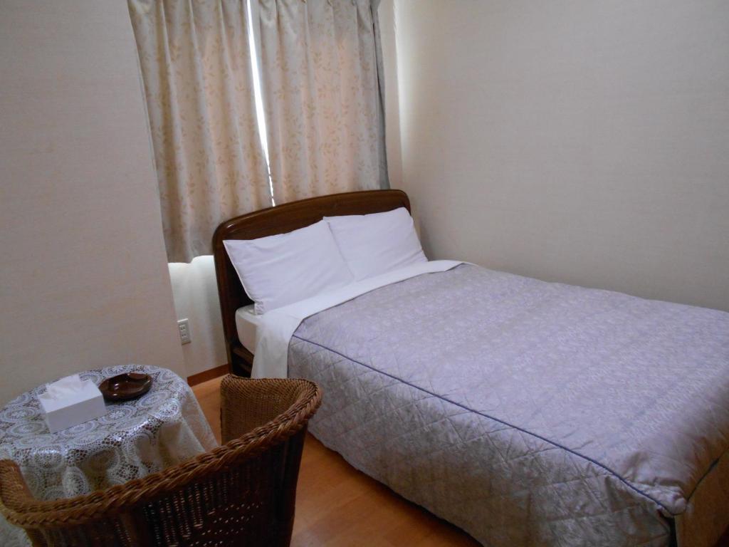 Postel nebo postele na pokoji v ubytování New Central Hotel Katsuta