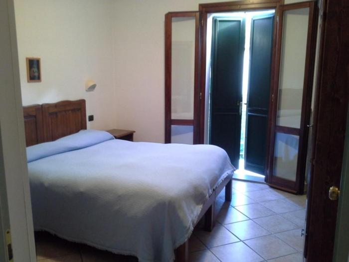 Łóżko lub łóżka w pokoju w obiekcie Acquacheta Valtancoli Hotel B&B