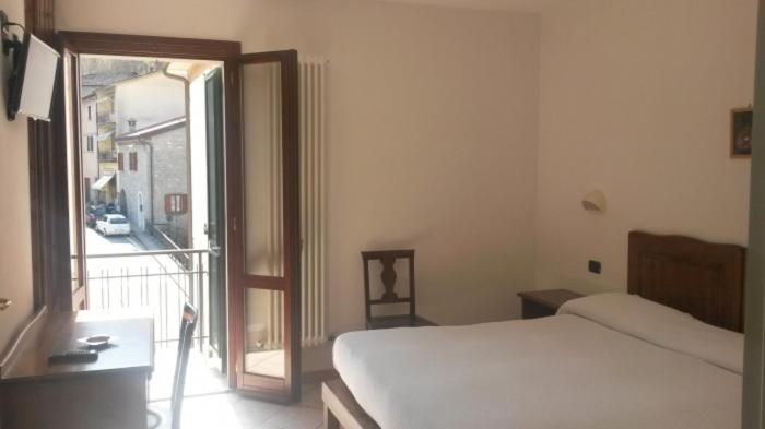 Łóżko lub łóżka w pokoju w obiekcie Acquacheta Valtancoli Hotel B&B
