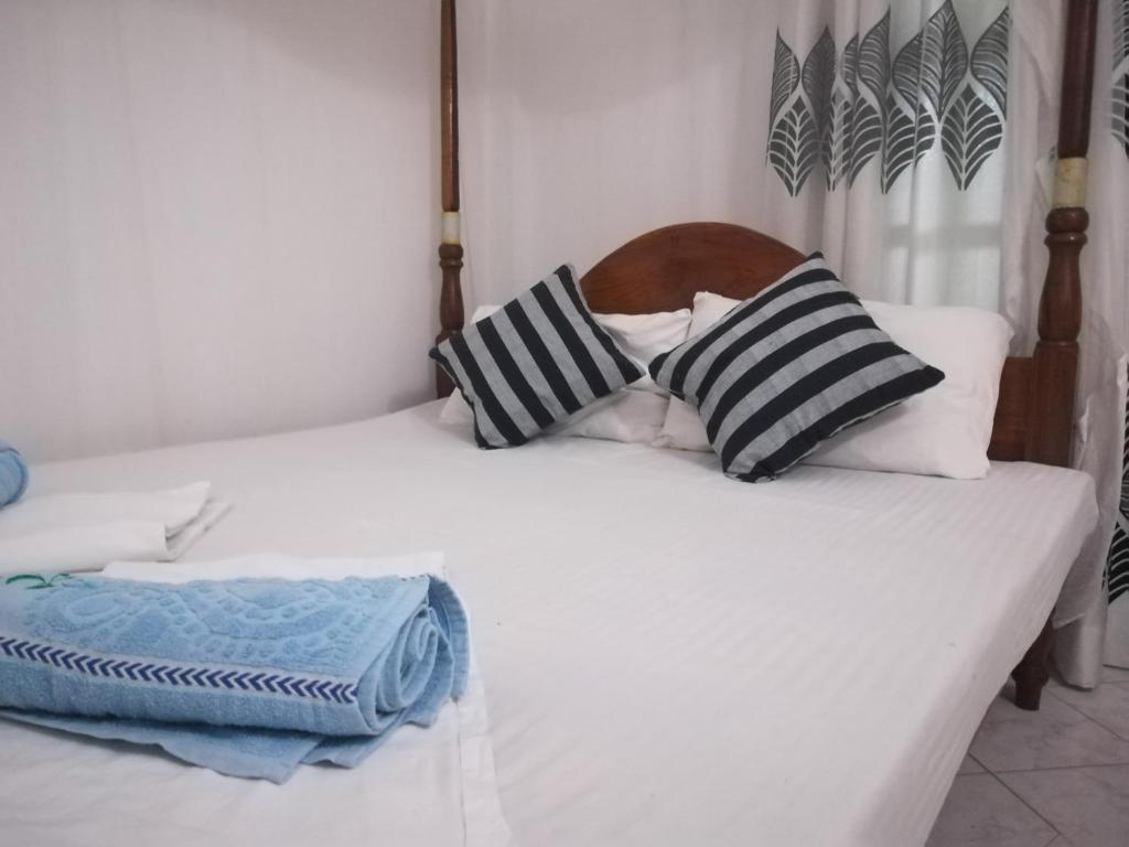 Postel nebo postele na pokoji v ubytování Hotel Sandara