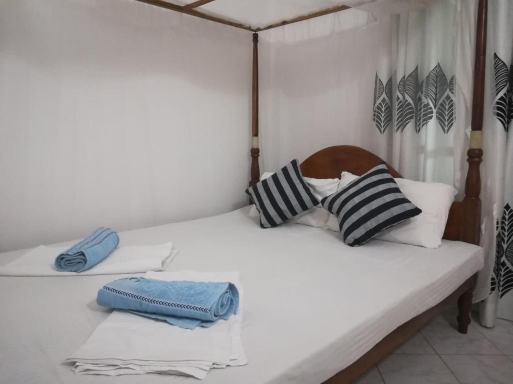 Postel nebo postele na pokoji v ubytování Hotel Sandara
