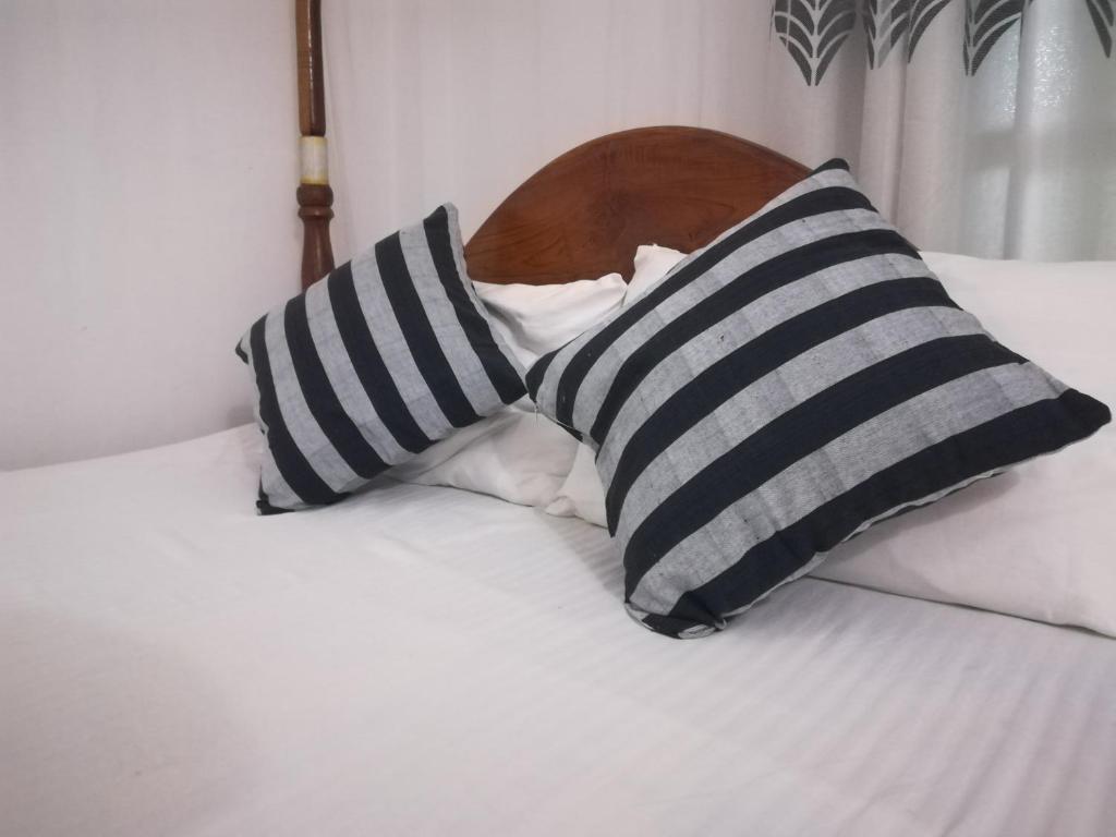 Postel nebo postele na pokoji v ubytování Hotel Sandara