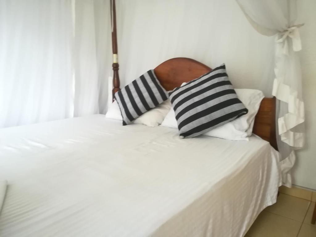 Postel nebo postele na pokoji v ubytování Hotel Sandara