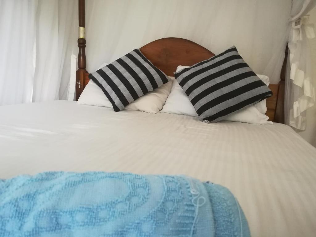 Postel nebo postele na pokoji v ubytování Hotel Sandara