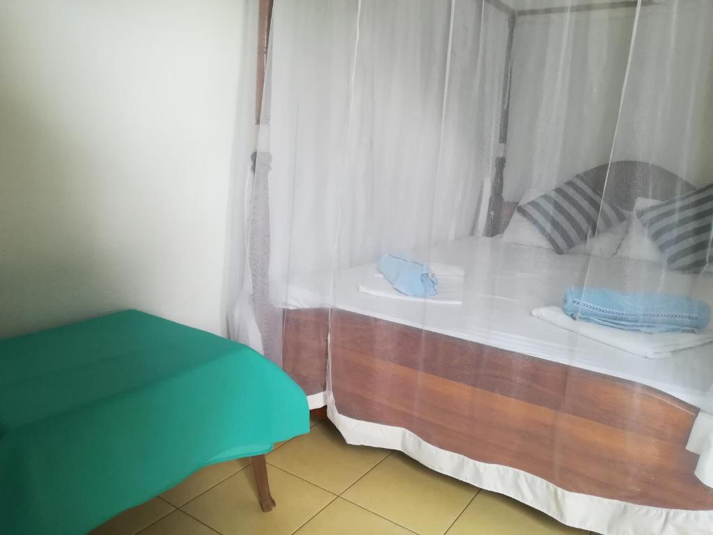 Postel nebo postele na pokoji v ubytování Hotel Sandara