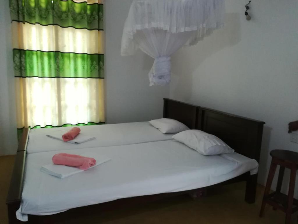 Postel nebo postele na pokoji v ubytování Hotel Sandara
