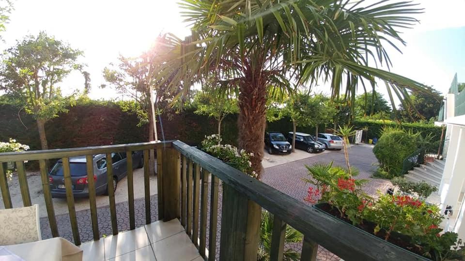 a balcony with cars parked in a parking lot at Hotel Ristorante Fortuna in Cavallino-Treporti