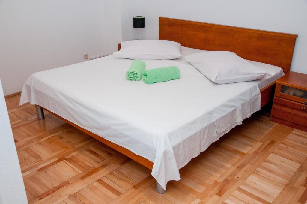 Posteľ alebo postele v izbe v ubytovaní Apartments Vulić