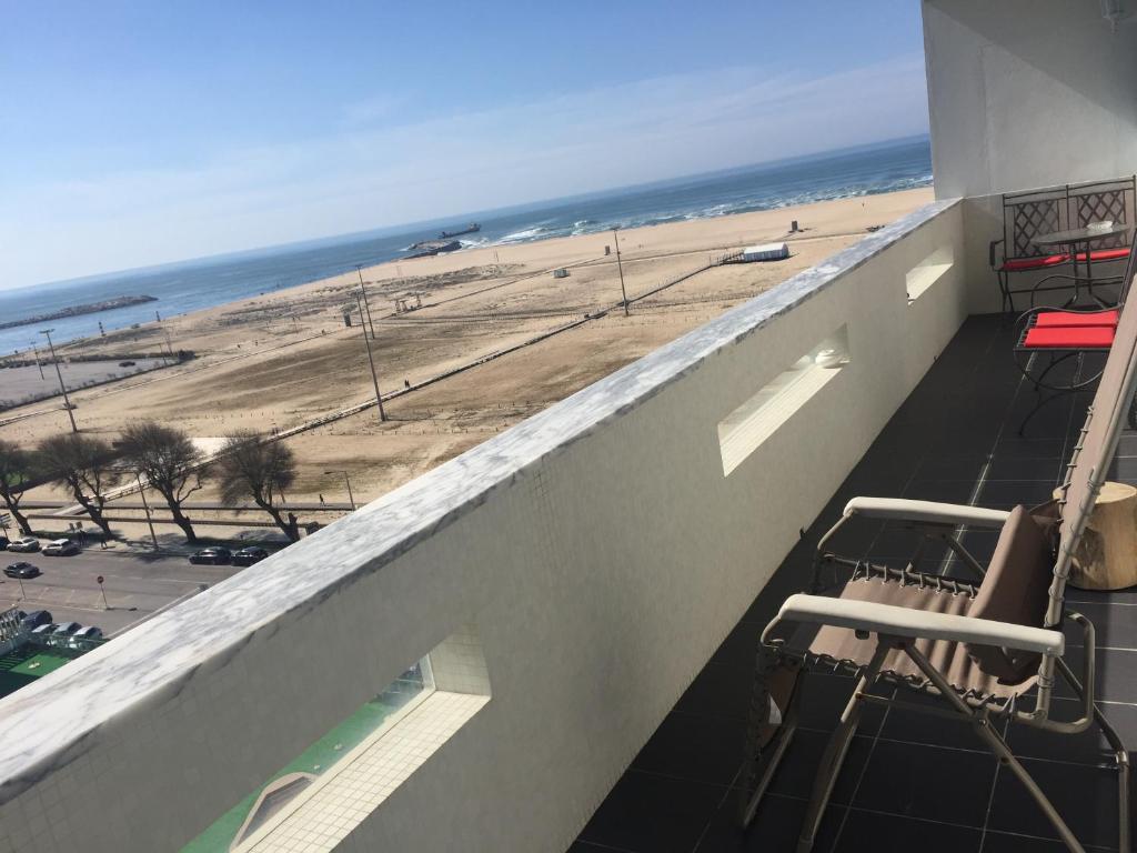 a balcony with a view of the beach at Casino & Beach Apartment in Figueira da Foz
