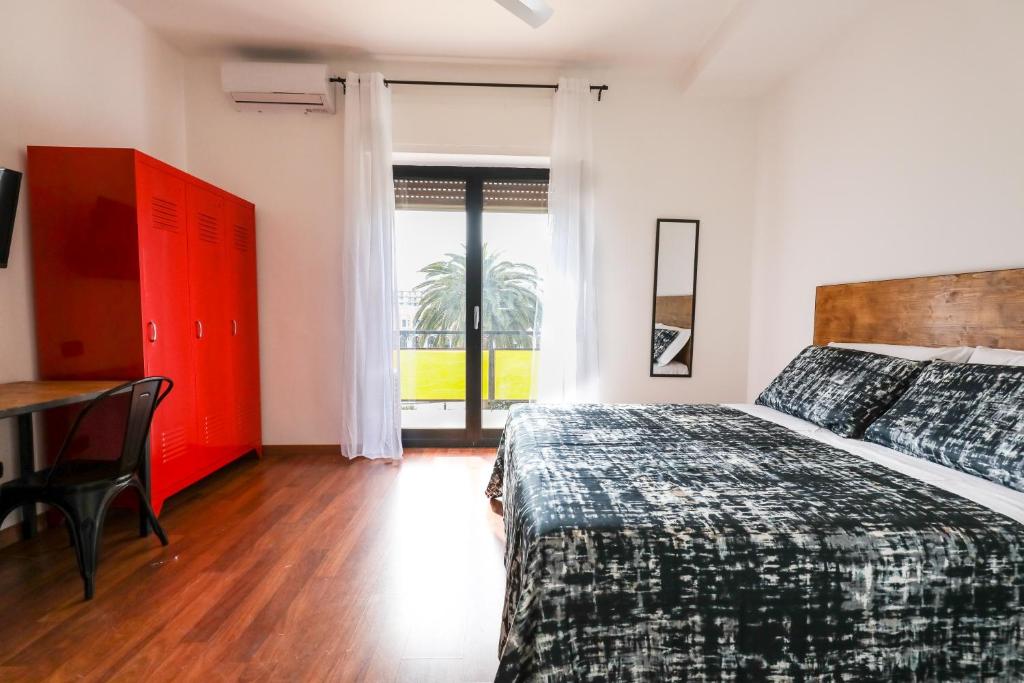 A bed or beds in a room at Travel B&B