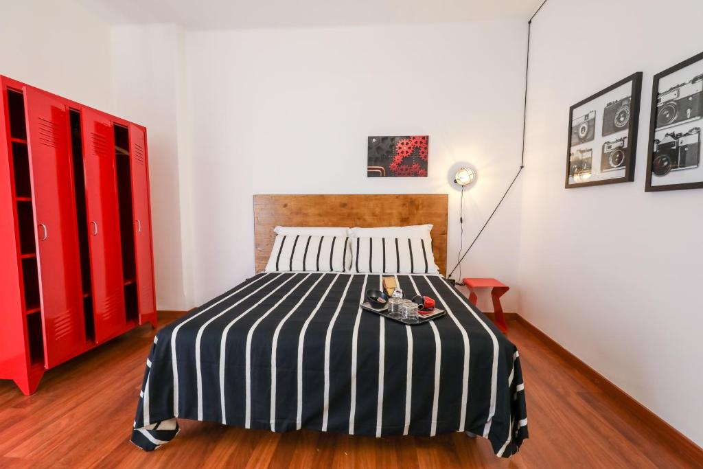 A bed or beds in a room at Travel B&B
