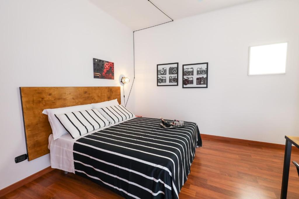 A bed or beds in a room at Travel B&B