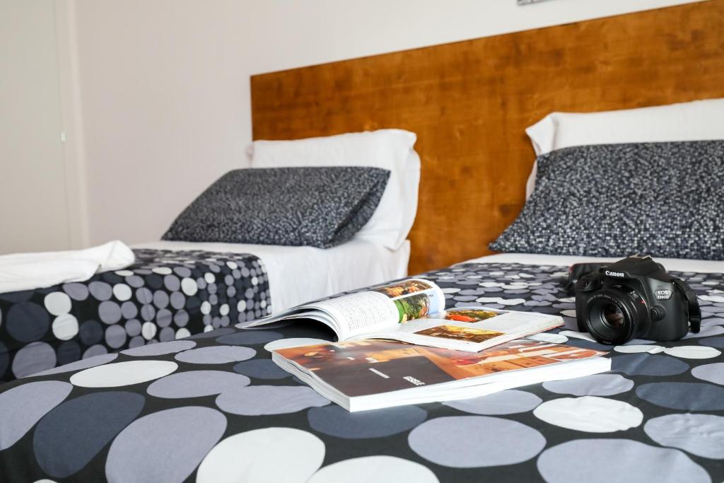 A bed or beds in a room at Travel B&B