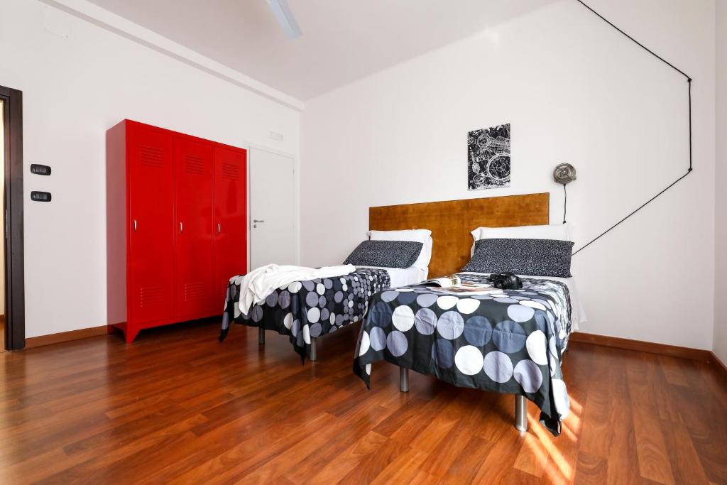 A bed or beds in a room at Travel B&B