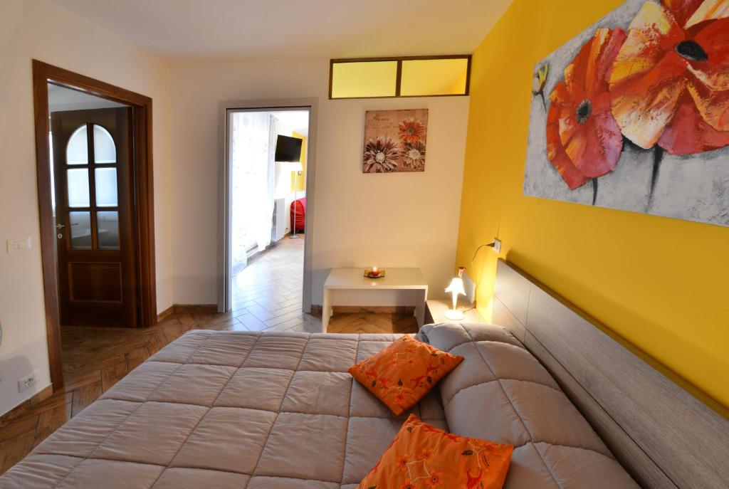 A bed or beds in a room at Le Palme Sona