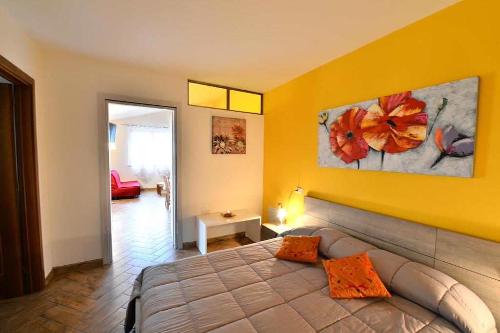 A bed or beds in a room at Le Palme Sona