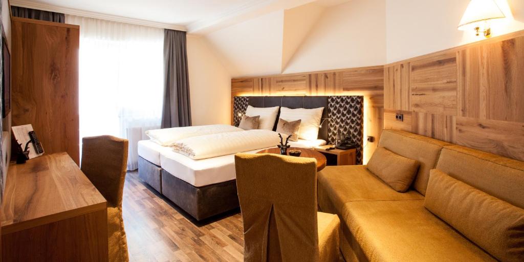 Postel nebo postele na pokoji v ubytování Hotel Gramaser