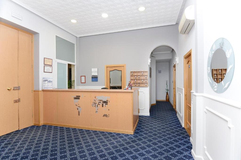 a view of a hallway with a waiting room at Hostal Biarritz in Madrid