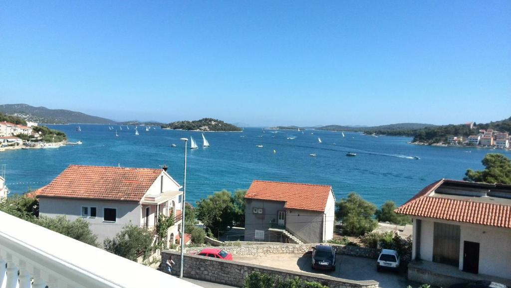 a view of a large body of water with boats at Judith Apartment in Tisno