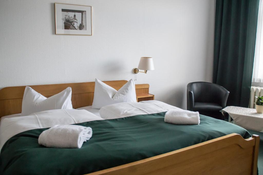 Postel nebo postele na pokoji v ubytování Central-Hotel Torgau
