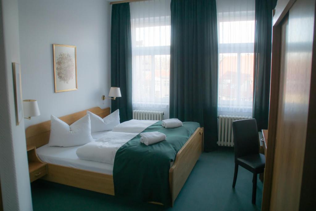 Postel nebo postele na pokoji v ubytování Central-Hotel Torgau