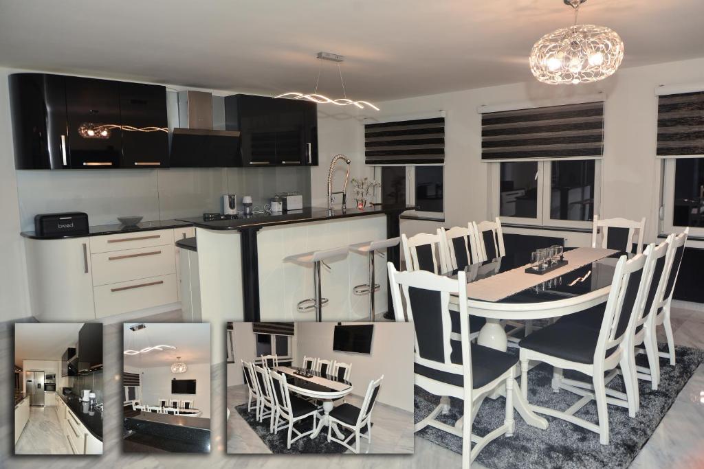 a kitchen with a table and chairs in a kitchen at Contemporary Home in Arandelovac