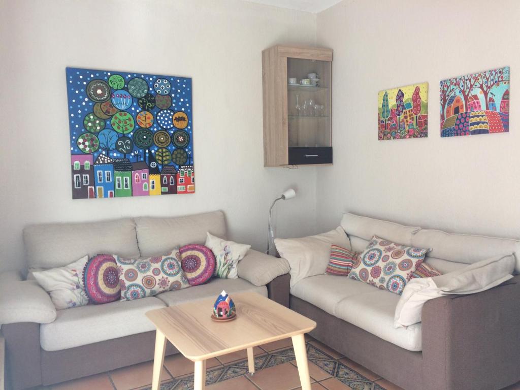 A seating area at Beachfront apartment in paradise
