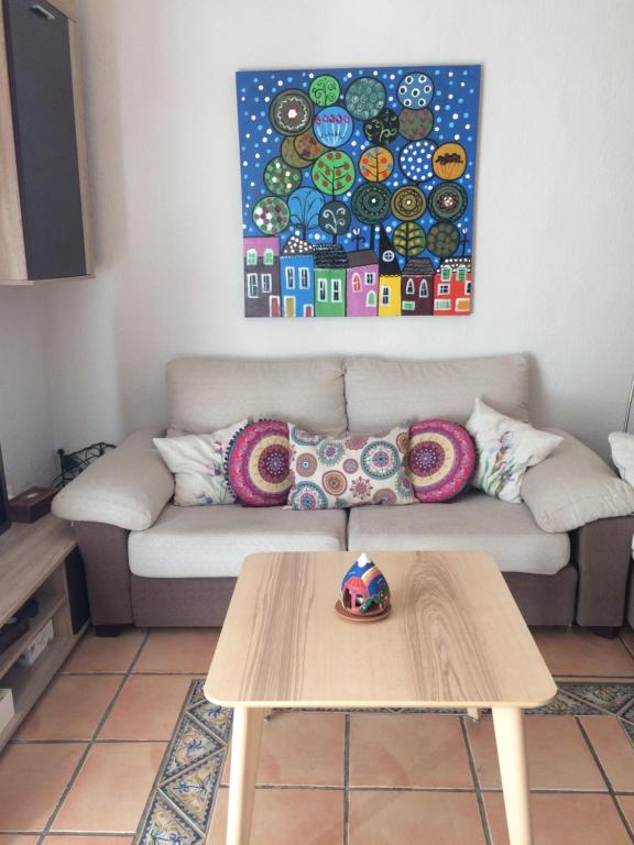 A seating area at Beachfront apartment in paradise