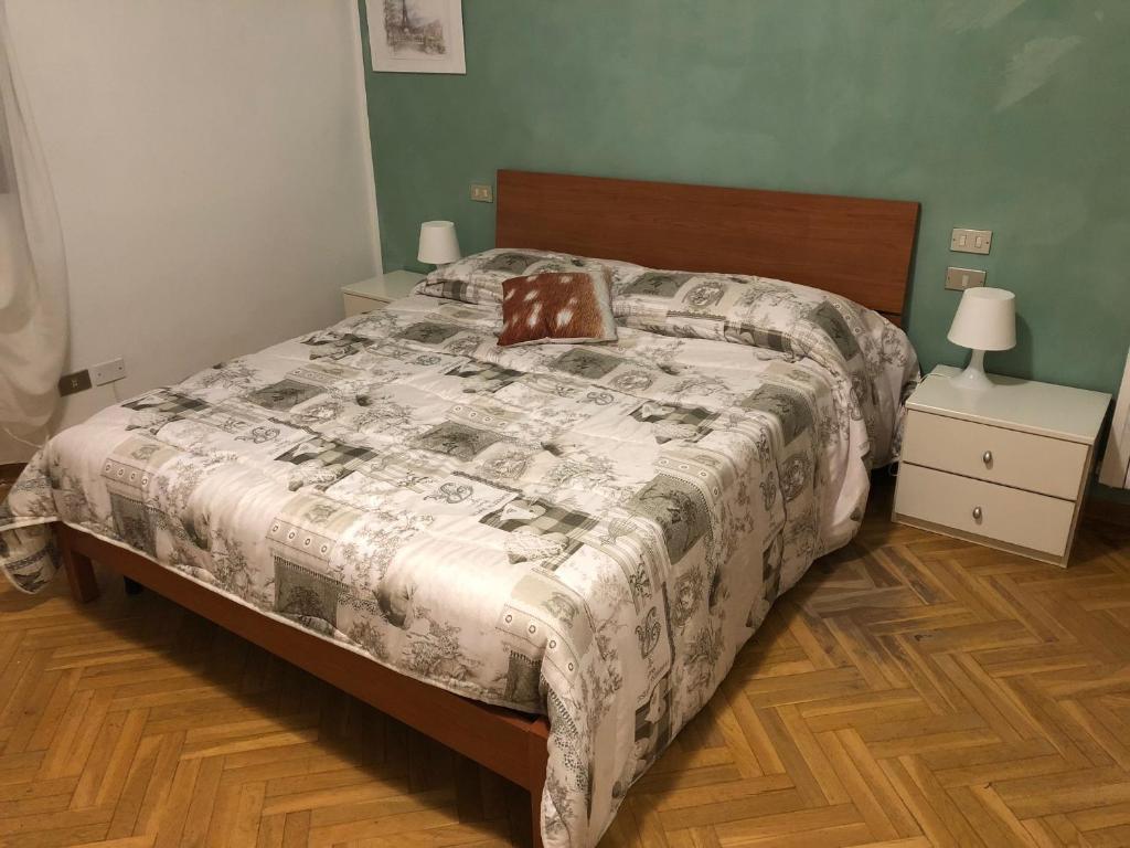 a bedroom with a bed with a brown pillow on it at Da Paola in Pisa