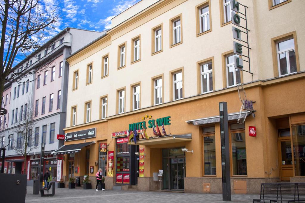 a row of buildings on a city street at Hotel Slavie in Cheb