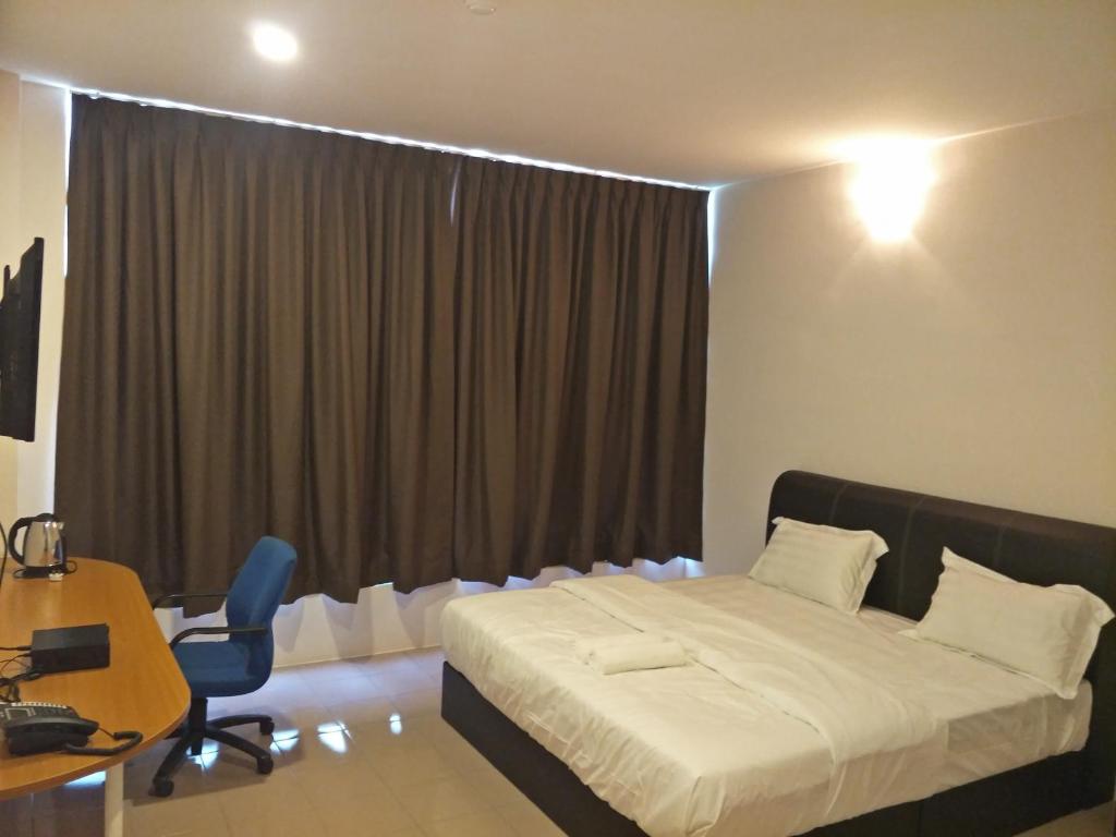 Postel nebo postele na pokoji v ubytování Anderson Hotel