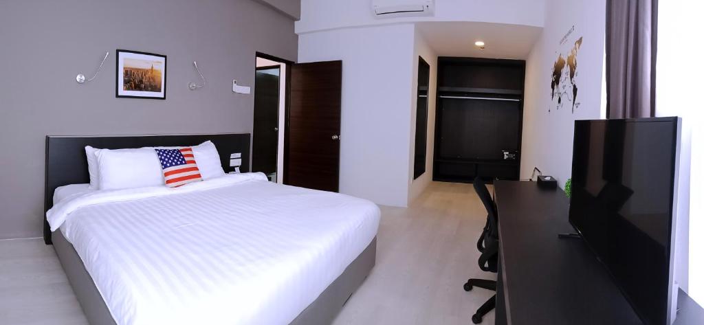 Postel nebo postele na pokoji v ubytování Manhattan Hotel Ipoh