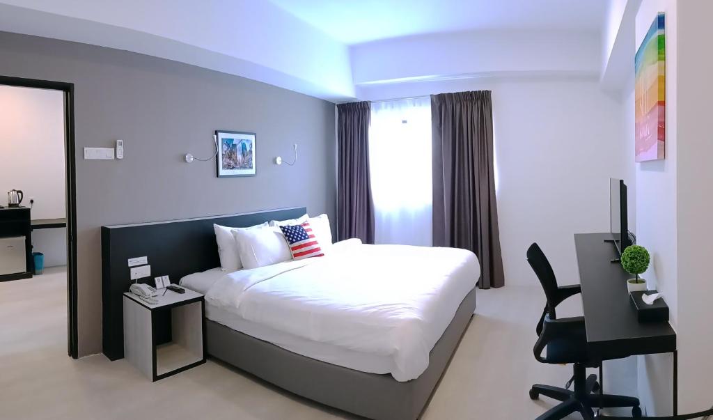 Postel nebo postele na pokoji v ubytování Manhattan Hotel Ipoh