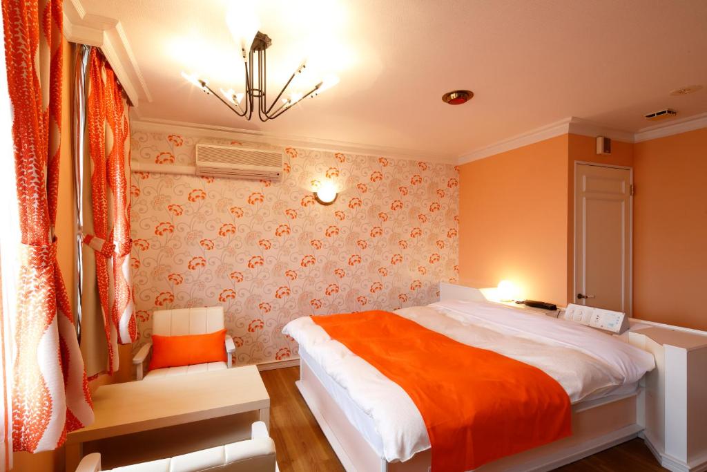 Postel nebo postele na pokoji v ubytování Hotel Sunset (Adult Only)