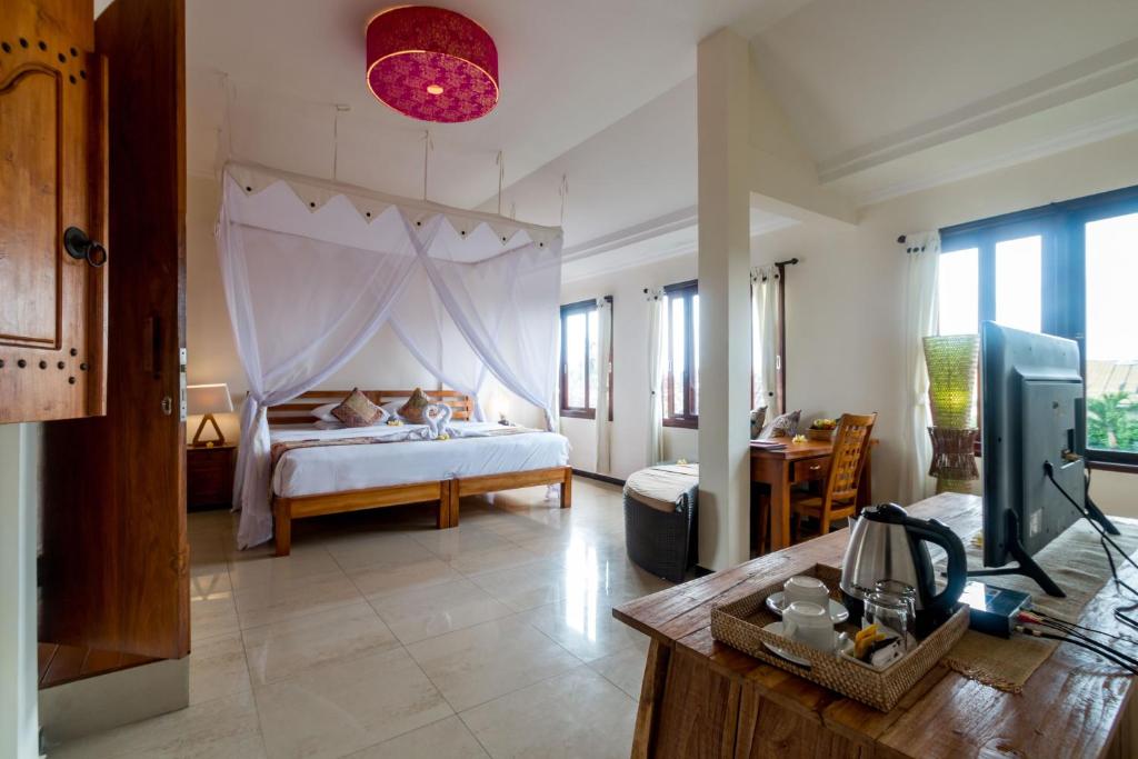 Ubud Aura Wellness Sanctuary房間的床