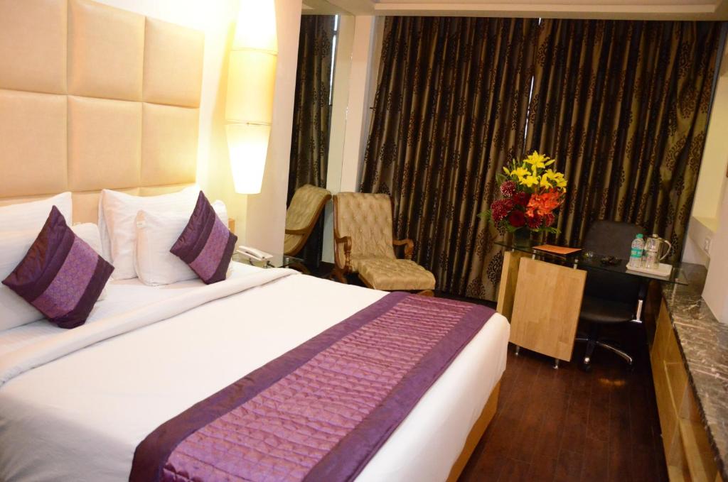 Postel nebo postele na pokoji v ubytování Airport Hotel Grand by Fantasia