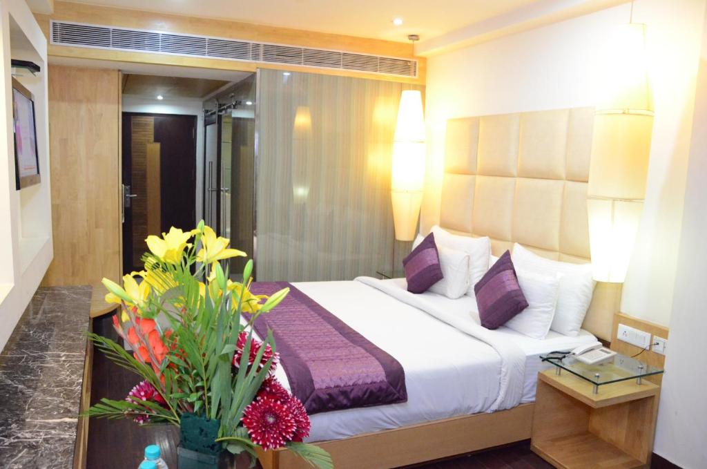 Postel nebo postele na pokoji v ubytování Airport Hotel Grand by Fantasia