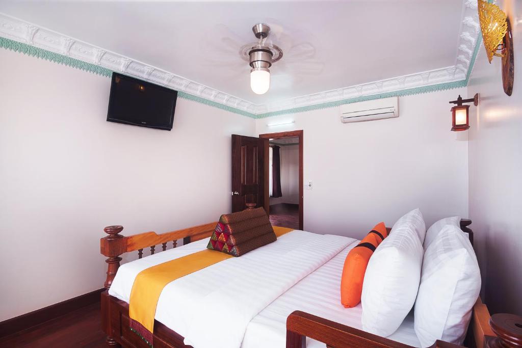 Postel nebo postele na pokoji v ubytování Hello Cambodia Boutique