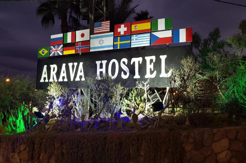 a sign that says araya hospital with many countries at Arava Hostel in Eilat
