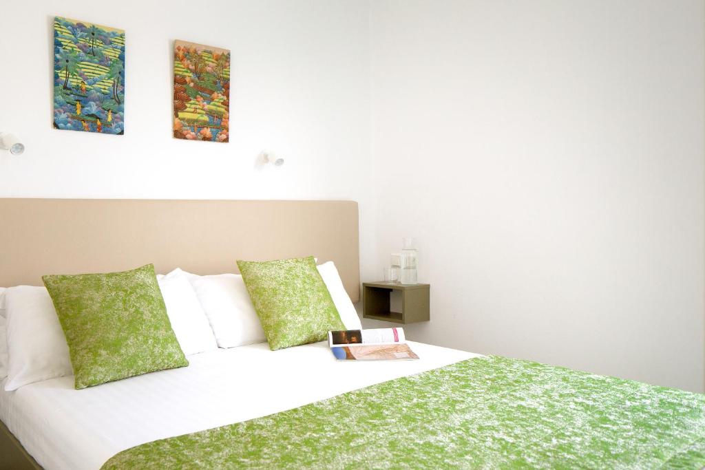 Postel nebo postele na pokoji v ubytování Apartamentos El Guarapo