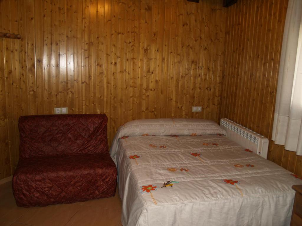 Posteľ alebo postele v izbe v ubytovaní Hostal Tribal